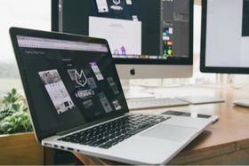 designing website on laptop